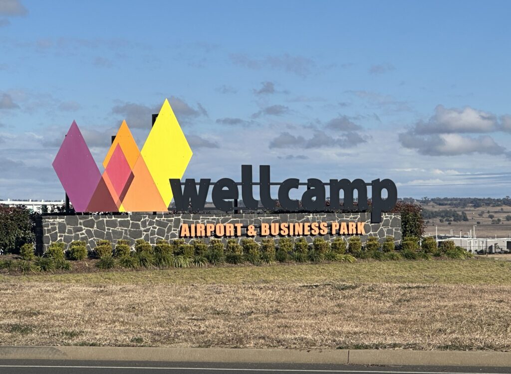 Wellcamp logo sign