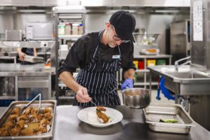 A Chef preparing a meal